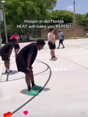 A group of people playing basketball on a concrete court. One person is bent over with hands on their knees, looking exhausted. The image has a bright, sunny feel with a green background of trees and the text overlayed in the upper left corner.