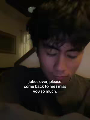 The cover image features a close-up of a young man's face. He's positioned slightly off-center, looking down with a sorrowful expression. The text overlay, in a simple white font, conveys a message of longing and sadness.