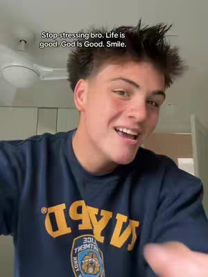 The cover image features a young person smiling, with text overlayed at the top. The person appears to be in an indoor setting with a ceiling fan visible in the background. They wear a dark blue t-shirt with yellow lettering. The overall composition is bright and inviting.