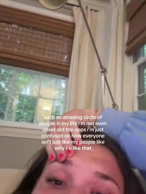 The image shows a close-up of a person's face, with the focus on their forehead and eyes. Text is overlaid on the image. The background includes hints of a window with curtains and blinds.
