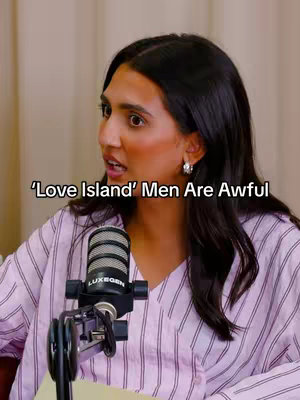 A woman with dark hair and hoop earrings is speaking into a microphone, with the text overlay on the upper right stating "'Love Island' Men Are Awful". The background is plain, and the overall lighting is soft.