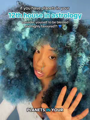 A woman with voluminous blue and black hair, a small nose ring, and a white top is centered in the shot. Text overlays are positioned at the top and bottom, while she gestures with her hand.