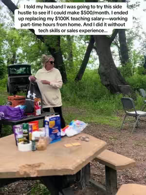 A woman stands in a wooded area near a picnic table, apparently outside. Various items are placed on the table. Text is overlaid on the image.
