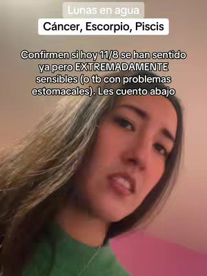 A woman's face is shown in a close-up shot and slightly angled to the side. She has long, dark hair. Above her head is a highlighted text overlay with the image including astrological topics. The background is a gradient, with pink hues on the right side blending into other colors on the left.
