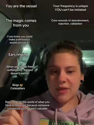 A selfie-style video from inside a car. The primary focus is on a person's face, with text elements overlaid. The person is positioned in the center-right of the frame, looking toward the viewer. The background shows the interior of the car.