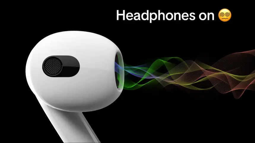 The cover image features a 3D render of a white earbud against a black background. From the earbud’s opening, strands of wavy lines in shades of green, blue, yellow, and pink emanate, suggesting sound waves. The text “Headphones on” appears above the earbud in white, accompanied by a dizzy face emoji. The overall composition is designed to visually represent sound or music.