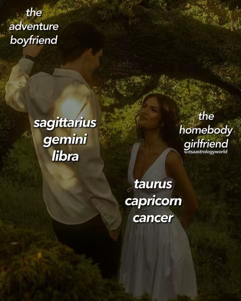 A photograph of a couple standing amidst lush greenery. The man, on the left, is wearing a light-colored shirt and dress pants, with his back partially to the camera, looking towards the woman. The woman, on the right, is wearing a white dress and facing the camera. Text overlays label them as 'the adventure boyfriend' and 'the homebody girlfriend,' respectively. Further text identifies astrological signs associated with each.