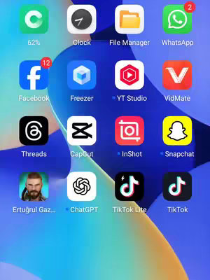 A screenshot of a phone's home screen is shown. The screen is displaying various app icons arranged in a grid-like fashion on a purple, blue-gradient background. There are at least three rows of icons visible.