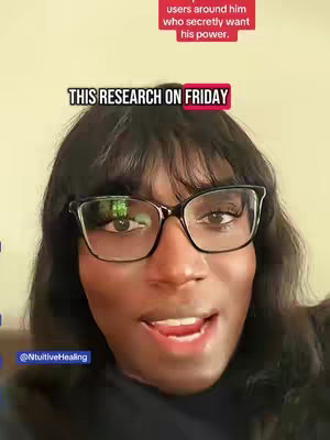 A woman with dark hair and glasses is centered in the frame, looking directly at the camera with a slight smile. Text overlays are present, one stating a date ("THIS RESEARCH ON FRIDAY") and another indicating the type of content ("users around him who secretly want his power"). The background is a muted yellow-beige color. The overall composition suggests a close-up selfie-style video.