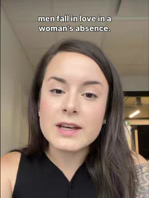 The cover image is a selfie-style shot featuring a woman with dark hair and fair skin against a nondescript background. Text overlayed at the top reads, "men fall in love in a woman's absence." The woman's expression is neutral, with her mouth slightly open, suggesting she may be speaking.