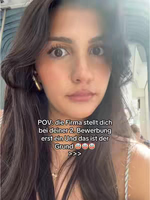 A selfie-style shot with a woman looking at the camera. She has dark hair, styled away from her face, and is wearing a delicate necklace and earrings. Text in a white box highlights a POV.