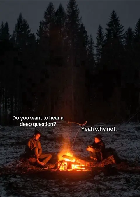 The image features two people sitting near a campfire in a forest at night. Text bubbles with the questions, “Do you want to hear a deep question?” and “Yeah why not.” are superimposed on the image. The fire is the focal point in the center, casting light on the seated figures and the surrounding snowy ground.
