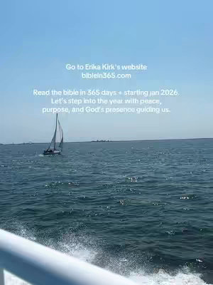 The image captures a scenic view from a boat. The foreground features a white railing. The midground showcases the ocean waves and a sailboat with a white sail. The sky is clear and blue. Text is overlaid on the image with white font.