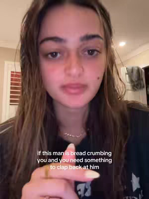 A close-up shot of a young woman with brown hair. She is looking directly at the camera and has a slight smile. Text in white appears at the bottom of the image stating 'if this man is bread crumbing you and you need something to clap back at him'.