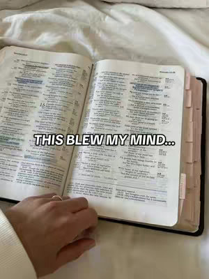 An open Bible is on a bed covered in white sheets. The book is open to a marked passage. A hand with a ring is visible, holding the book. The overlay text 'THIS BLEW MY MIND...' is present.