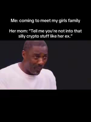 The image shows a screenshot of a video meme featuring actor Idris Elba. He is looking down and slightly to the side in what seems to be a moment of contemplation or concern. Overlaid on the image are two lines of white text, the first indicating a scenario about meeting a girlfriend's family, and the second the mom's anticipated reaction about crypto.