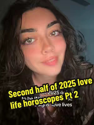 A selfie-style video cover image features a light-skinned woman with long, wavy dark hair. She has brown eyes and is smiling slightly. She's wearing a top with a camouflage pattern. Overlaid on the image is a yellow text box that states "Second half of 2025 love life horoscopes Pt 2". The background appears to be a shadowy, neutral color.