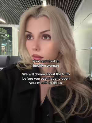 A woman with long blonde hair and dark eyes is centered in frame, looking slightly upward. The background appears blurred and indicates a train setting. Text overlayed on the image presents an assertive quote.