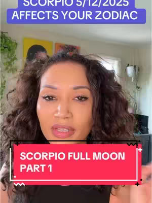 The image features a woman speaking directly to the camera. Two rectangular text overlays are visible: one in a purple banner at the top stating, "SCORPIO 5/12/2025 AFFECTS YOUR ZODIAC", and another red banner at the bottom reading "SCORPIO FULL MOON PART 1". The background includes a partially visible interior with artwork, plants, and a window, creating an overall aesthetic.