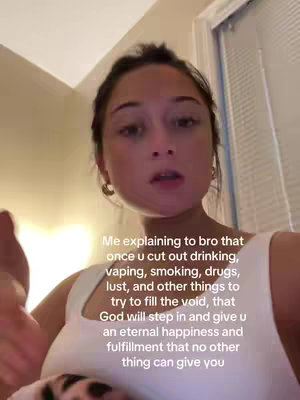 A woman with brown hair and fair skin is speaking in the foreground of the image. The background appears to be an indoor setting with a window, with a text overlay describing self improvement and spirituality.