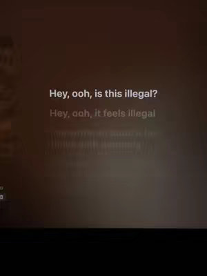 The image is a dark brown screen with text overlayed on it. The background provides a blurred effect, and the text is in a clean, white font. The text conveys a line from a song. There is a low camera angle.