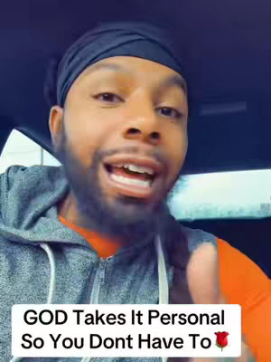 A man with a black head wrap and a beard is speaking directly to the camera with an emotive expression. Text overlaid on the image states, 'GOD Takes It Personal So You Don't Have To' with a rose emoji at the end. The background appears to be a car interior.