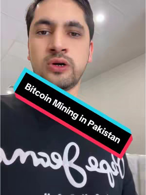A man in a black t-shirt is in the center of the frame looking at the camera, a multi-colored text box at an angle on the image that says "Bitcoin Mining in Pakistan". The man is in front of a white background with no other setting or context.