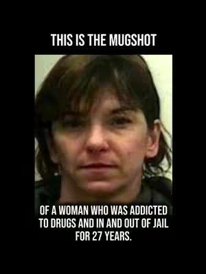 The cover image is a portrait-style image of a woman with dark hair, facing the camera, and is situated centrally against a black background. The woman appears to be in her mid-50s, with a neutral expression. Above the image, in a white sans-serif font, it says 'THIS IS THE MUGSHOT'. Below the photograph, white text narrates, detailing the woman’s past struggles with addiction and incarceration.