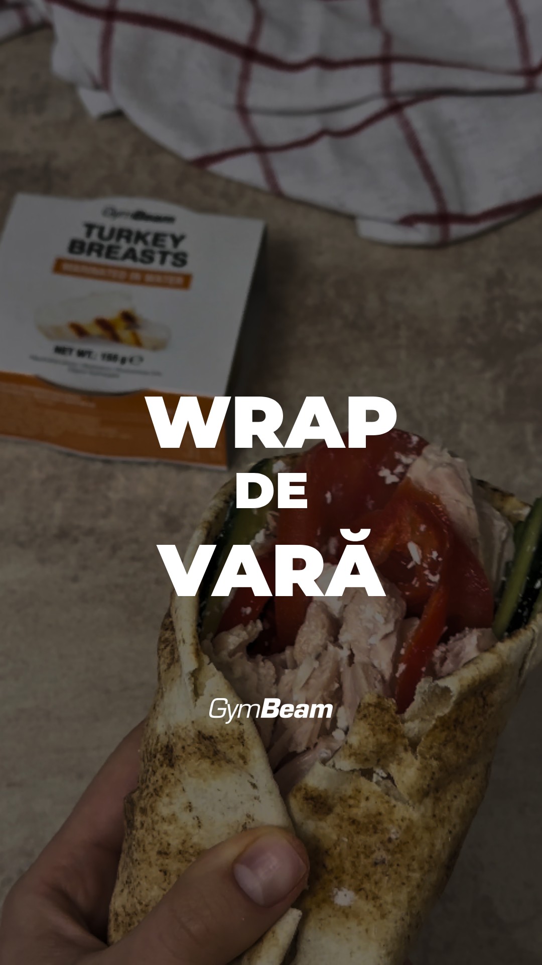 The cover image showcases a wrap with filling held by a hand. The wrap is mostly in focus, showing its contents: red tomatoes or peppers, and chicken. The background features a food product, a box of 'Turkey Breasts' with a white and brown color, and a white and red checkered cloth. The layout gives a sense of a quick, healthy meal.