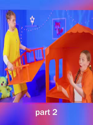 A cover image shows a man carrying an orange play structure with a surprised woman pointing to it. The setting appears to be a child's room, with a framed picture of a fox and star-shaped lights on a blue wall. The text 'part 2' is at the bottom.