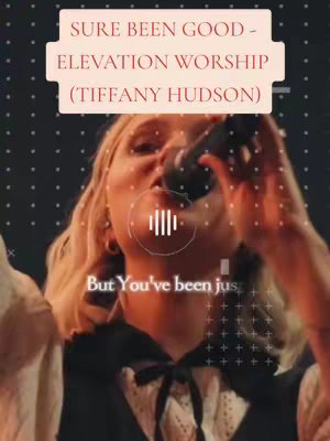 A vertical video cover image featuring a woman singing into a microphone against a dark background. Overlayed in the top third is a text box with song information: 'SURE BEEN GOOD - ELEVATION WORSHIP (TIFFANY HUDSON)'. Below, faint white plus signs and dots create a textured background.