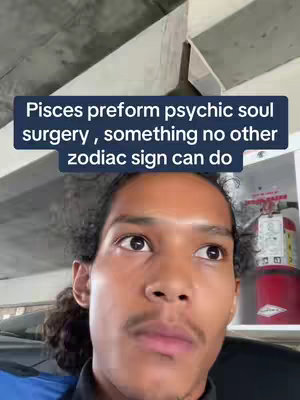 The cover image features a close-up of a man's face, positioned from the chest up. The man has dark curly hair and a mustache. A textual overlay in a blue box reads, "Pisces preform psychic soul surgery, something no other zodiac sign can do". The background includes a light gray structure with angular lines and what appears to be a fire extinguisher.
