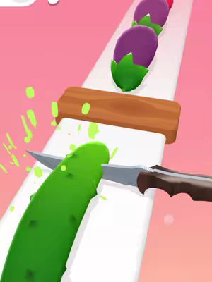A colorful game scene showing a knife slicing a cucumber. The background is a light pink, and the slicing takes place on a white surface. Other colored vegetables, including eggplants, are arranged behind the cucumber.