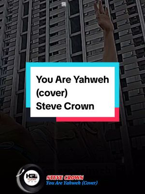 The cover image features a man with one arm raised towards the sky, set against a background of an urban building. The text overlay includes the song title and artist's name, placed within a rectangular box. A logo is present on the lower left.