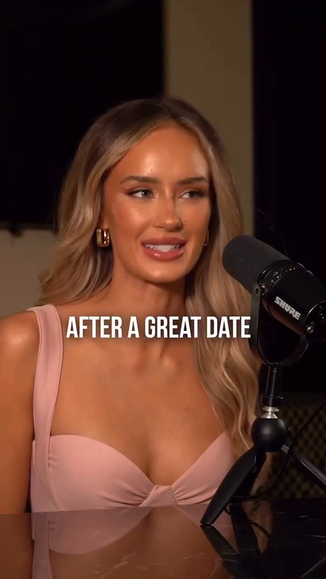A woman with long blonde hair is seated in front of a dark background. She's wearing a blush pink top and gold earrings. A black microphone stand is positioned to her right, and the Shure microphone is in front of her. Text overlayed on the bottom says "AFTER A GREAT DATE".