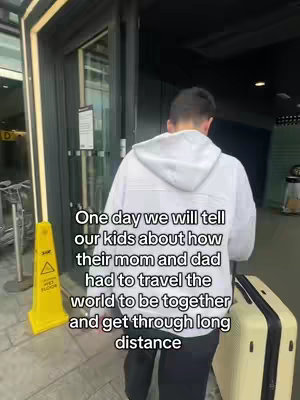 A person walking away from the camera, through a doorway. Text overlays the image.