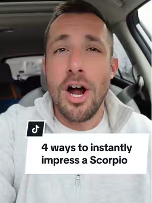 A man in a car looking directly at the camera with his mouth open in a speaking position, with text overlayed on the bottom.