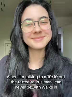 The cover image shows a woman with long, dark hair and glasses smiling. Text overlay at the bottom reads: "when i'm talking to a 10/10 but the tatted taurus man i can never be with walks in". The background appears indoor with a door visible.