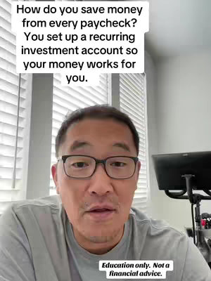 A man with glasses is centered in a selfie-style shot, looking towards the camera. Above him is text discussing how to save money by setting up a recurring investment account. The background is a neutral-toned room.