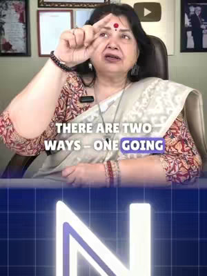 The cover image features a woman gesturing with her fingers, a red bindi on her forehead, and overlaid text. She appears to be speaking, and the background includes framed pictures and a blurred play button graphic.