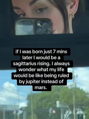 The cover image captures a selfie-style shot of a person looking at their phone, with the reflection showing part of their face and the interior of a vehicle. The foreground features the phone itself. The background suggests an outdoor setting, possibly with foliage visible through a window. Text overlays appear on the glass, with black rectangular boxes, and the font is white.