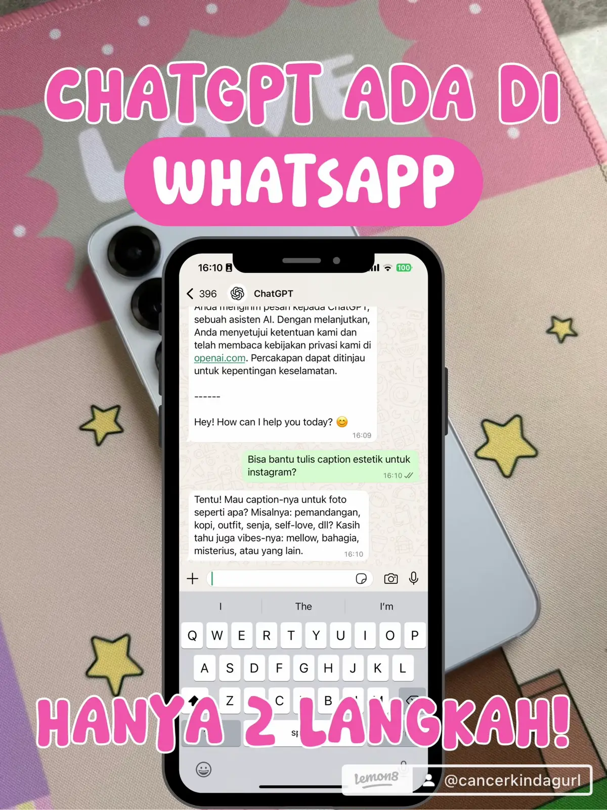The image shows a smartphone displaying a WhatsApp chat with ChatGPT. The phone rests on a pink surface, likely a mousepad, with text overlays in a bubble font. One reads "CHATGPT ADA DI WHATSAPP" (ChatGPT is on WhatsApp) in large, pink letters. Another, "HANYA 2 LANGKAH!" (Only 2 steps!), is at the bottom. The interface shows a user prompting ChatGPT to write an Instagram caption. A simple background of pink and white floral pattern surrounds the phone, alongside small star graphics.