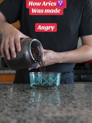 A man pouring coffee beans from a clear jar into a clear bowl on a countertop. The image has text overlays.