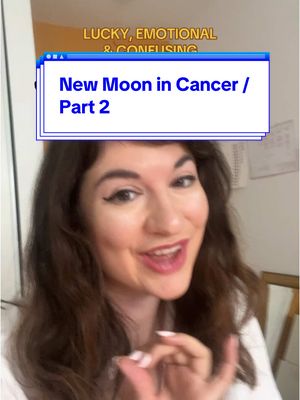 A woman with long, wavy brown hair smiles directly at the camera, making an 'okay' hand gesture. She is set against an out-of-focus background. Overlay text in a framed style advertises 'New Moon in Cancer / Part 2', and additional yellow text reads 'LUCKY, EMOTIONAL & CONFUSING'.