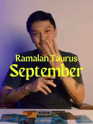 A medium shot shows a man with short dark hair smiling and gesturing with his hand, three fingers extended. Behind him is a purple-toned background. Text is overlaid in yellow, reading "Ramalan Taurus September". Several tarot cards are laid out in front of him.