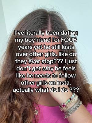 The cover image is a selfie featuring a young woman with long brown hair parted down the middle. She's wearing a pink top and multiple bracelets on her wrists. Text is overlaid on the image, written in a bold, white font, posing a relationship question.