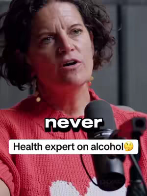 A woman is speaking into a microphone. There are text overlays in the image.