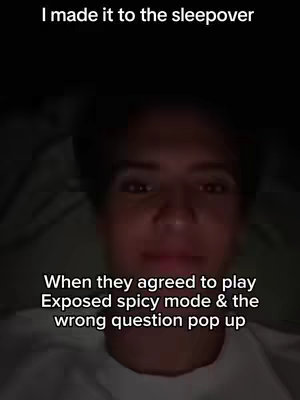 A selfie-style shot focused on a person in a dimly lit setting. The person is in the foreground with a slightly blurred background. White text overlays are positioned at the top and bottom of the image.