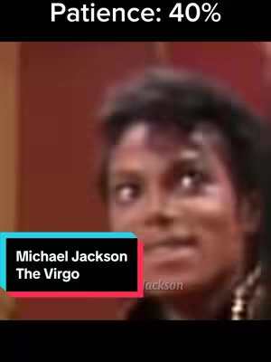 The cover image shows a medium shot of Michael Jackson looking off to the side with a slightly quizzical expression. Above him is white text on a black bar at the top that says "Patience: 40%". At the bottom, there's a text overlay in a teal rectangular shape with the words "Michael Jackson The Virgo". The setting appears to be indoors, with a warm-toned background, possibly a wall. The overall composition suggests a meme or a piece of content related to astrology and the singer.