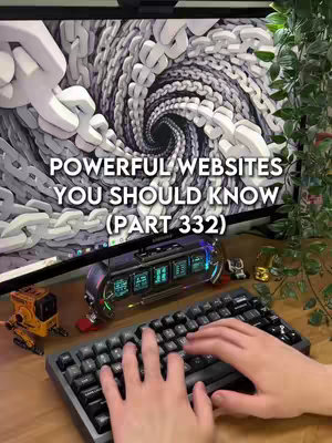 A cover image showing a desk setup with a computer monitor displaying a 3D chain link design on the screen. A mechanical keyboard with visible hands typing is in the foreground. Various desk accessories like a robotic figure and other decorative elements are present. Green plant stems are on the right side, and text overlays the top section.